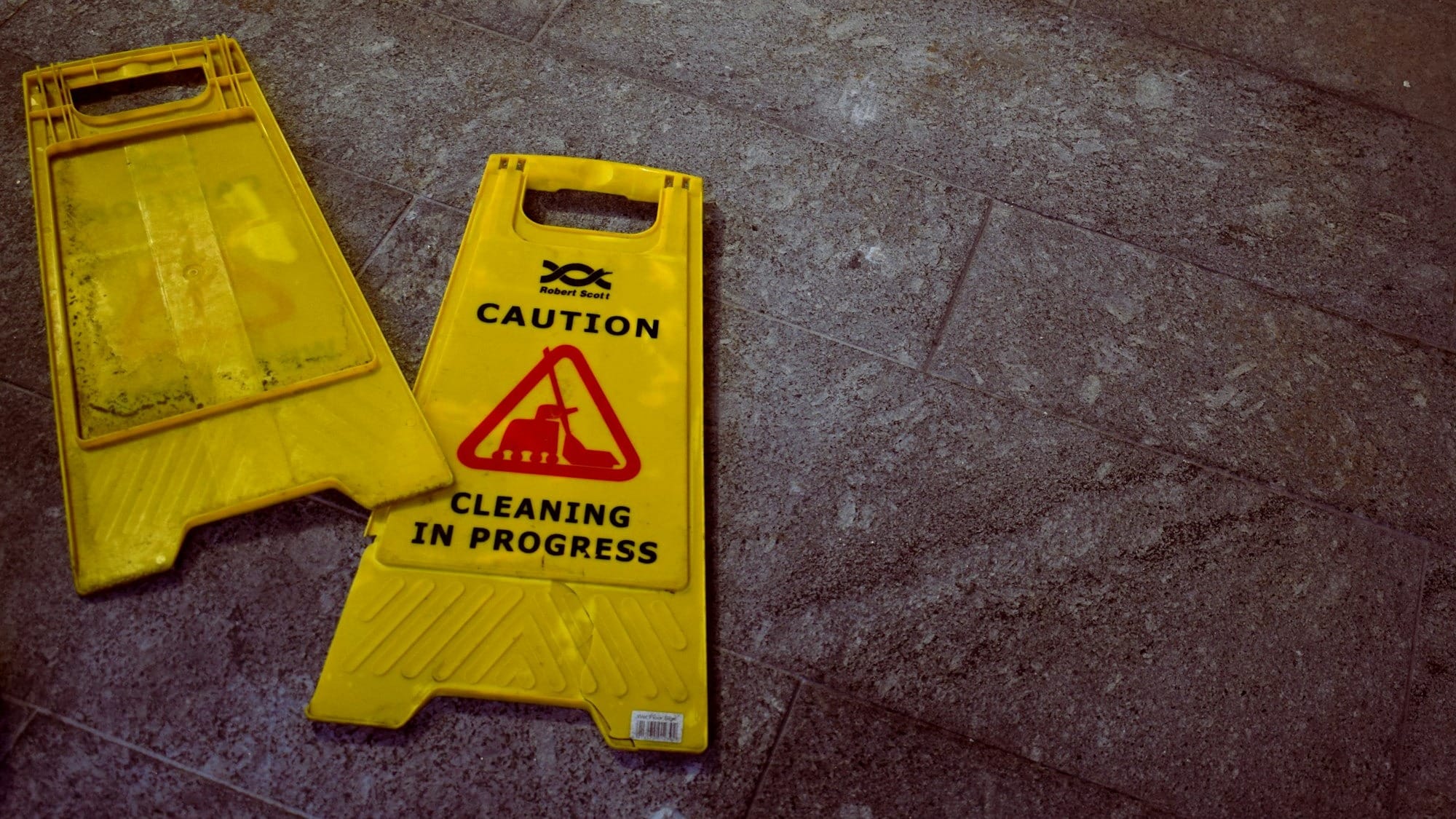 two Caution signages